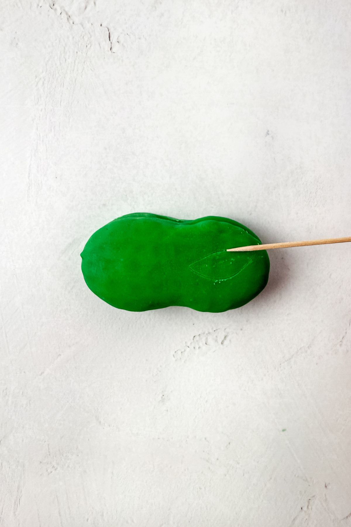 Drawing eyes with toothpick.