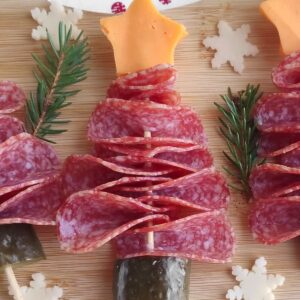 Salami christmas tree appetizers on a cutting board.