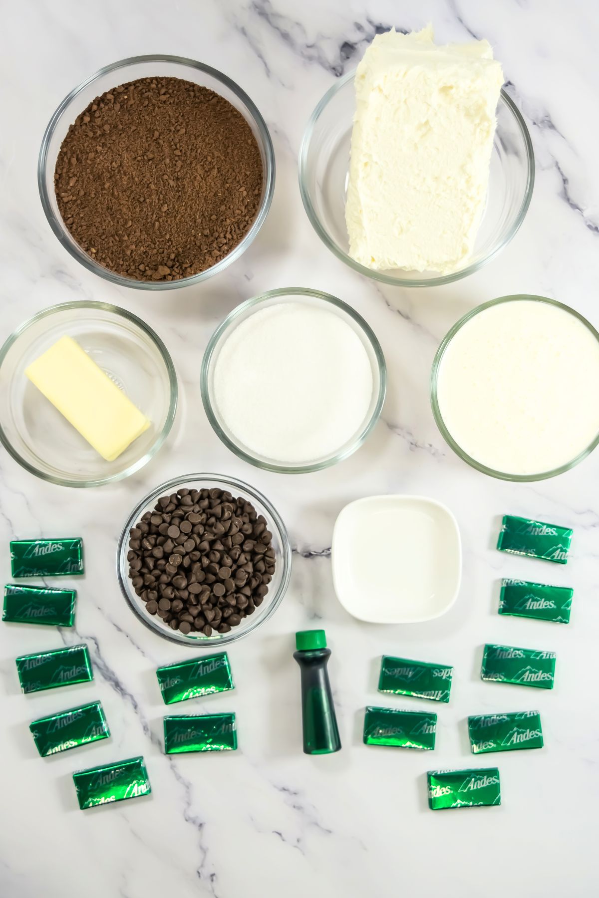 Andes mint cheesecake ingredients on a marble counter.