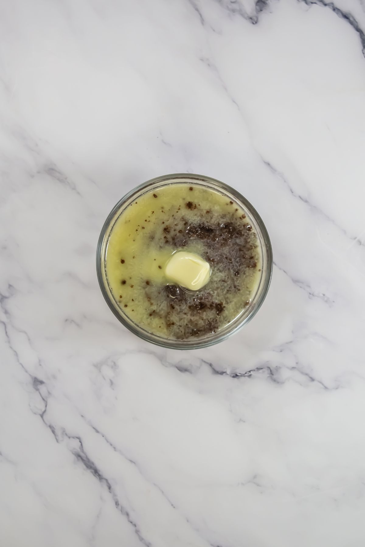 Melted butter and crushed chocolate in a bowl.