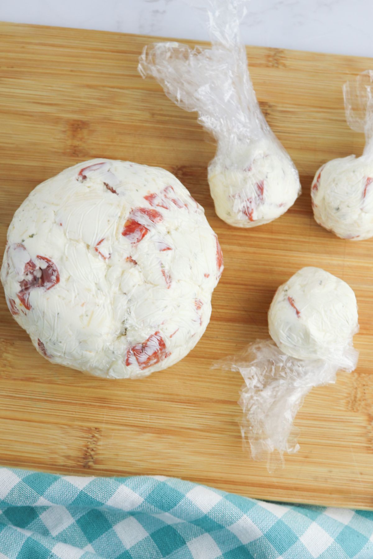 Cheeseballs wrapped in saran wrap.