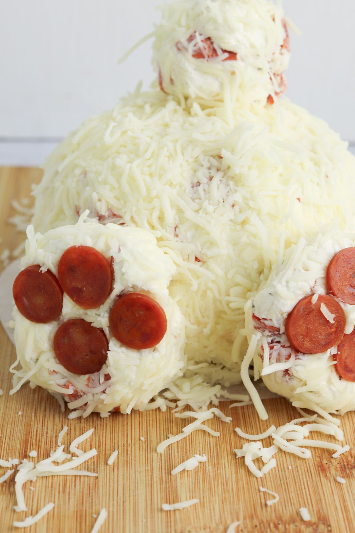 Bunny butt cheeseball on a cutting board.