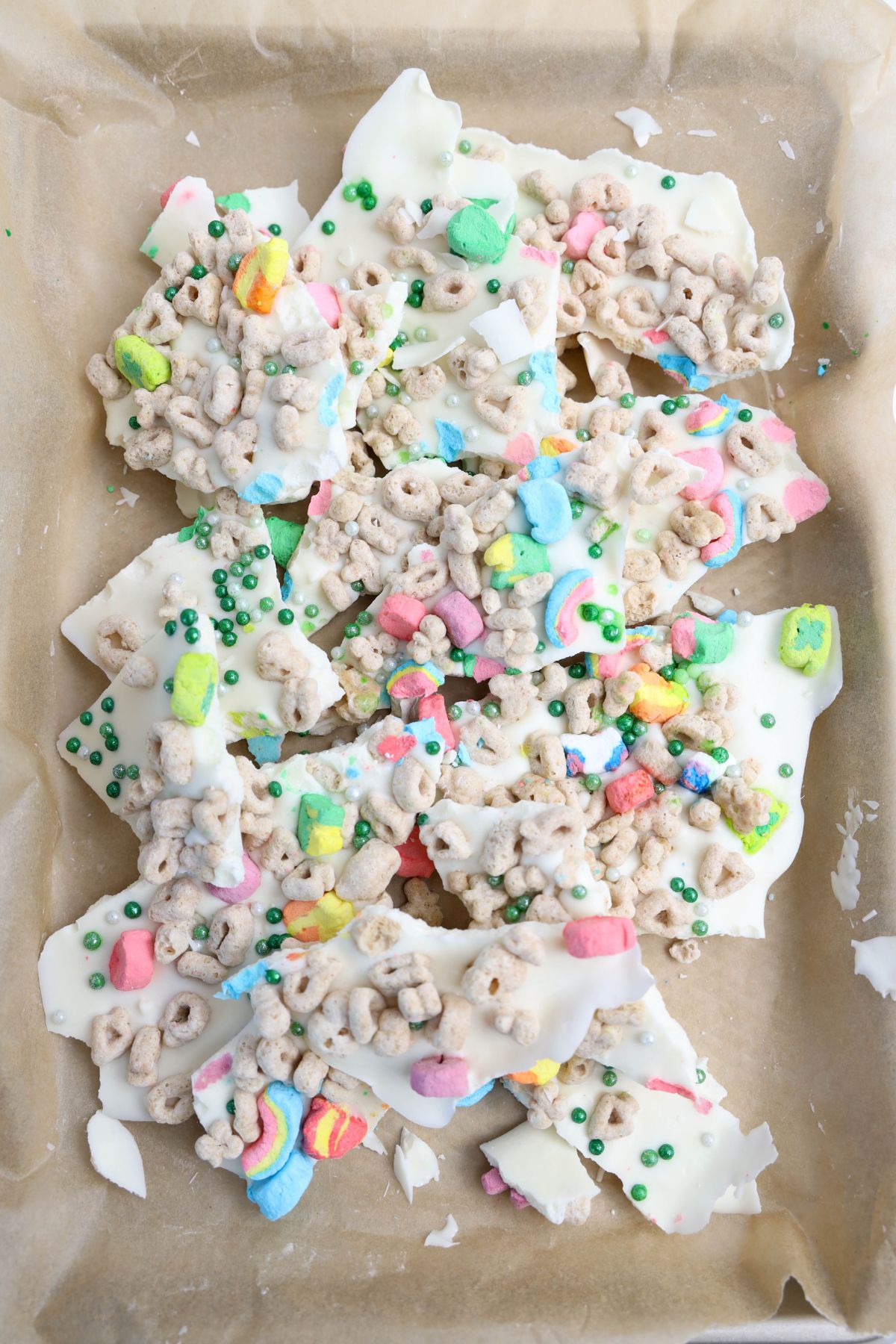 Lucky charms bark broken up on parchment paper.