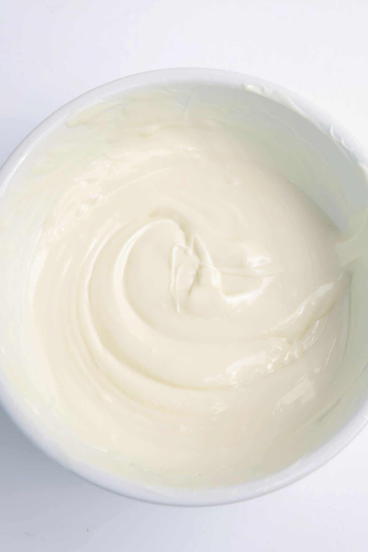 Melted white chocolate in a bowl.
