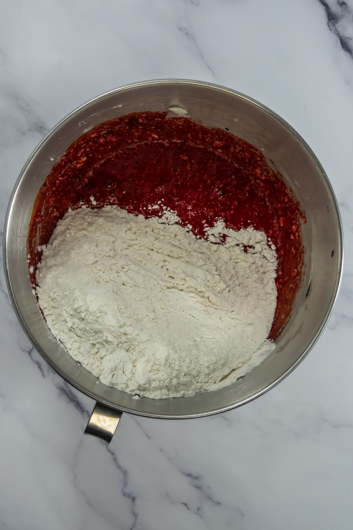 Flour added into mixing bowl.