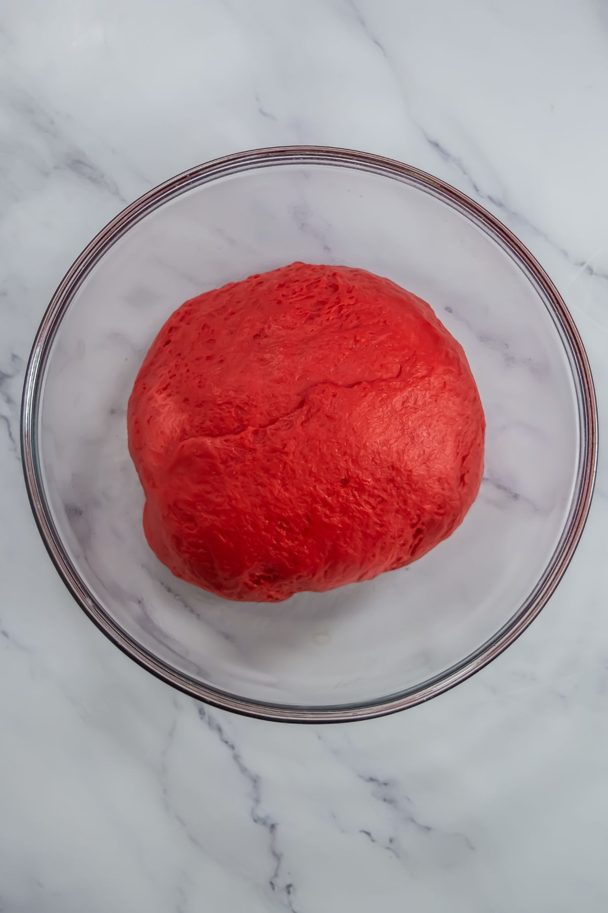 Red velvet dough in bowl.