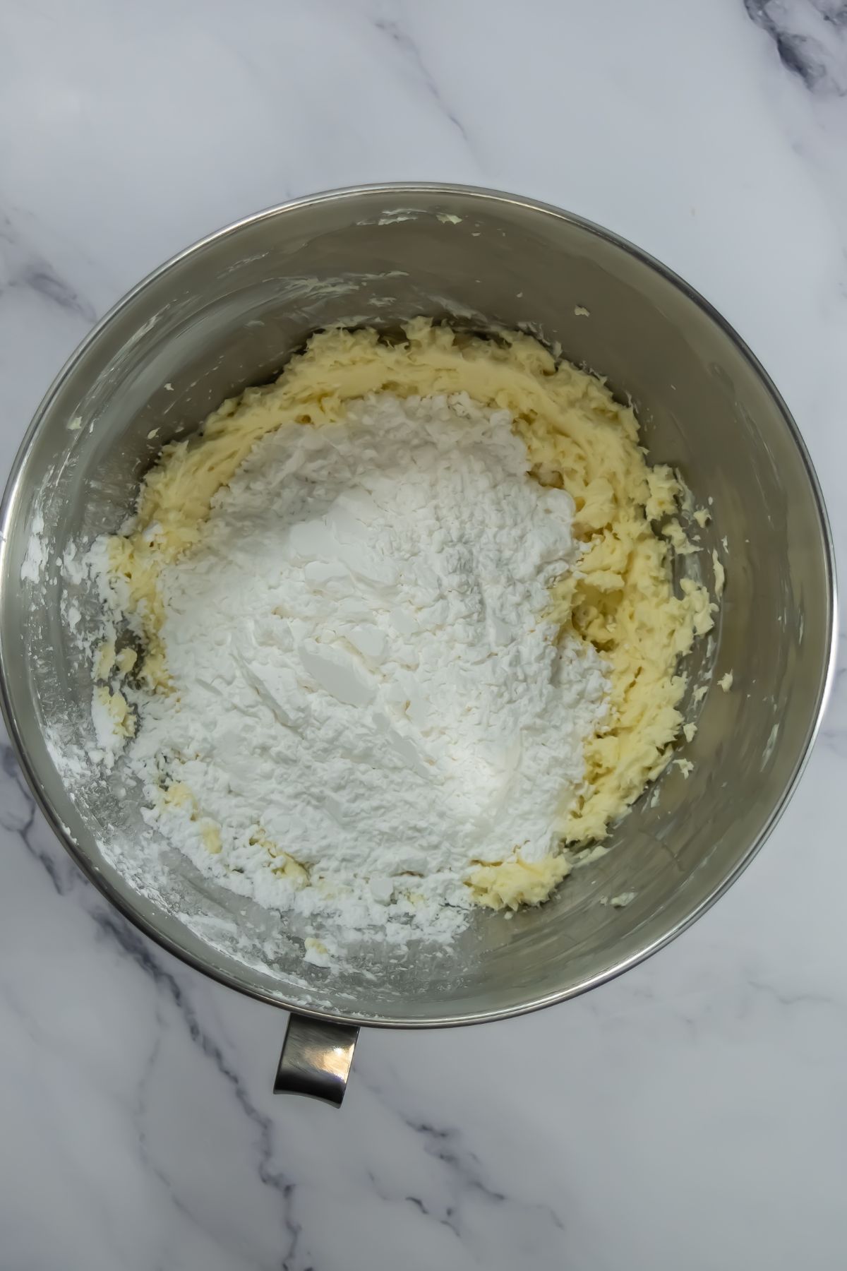 Sugar added to mixing bowl.