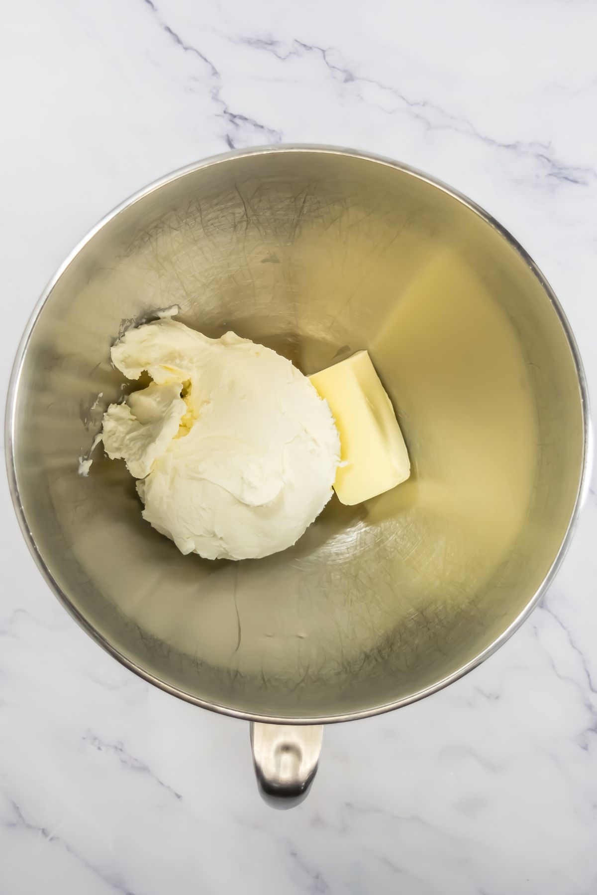 Butter and sugar in a mixing bowl.