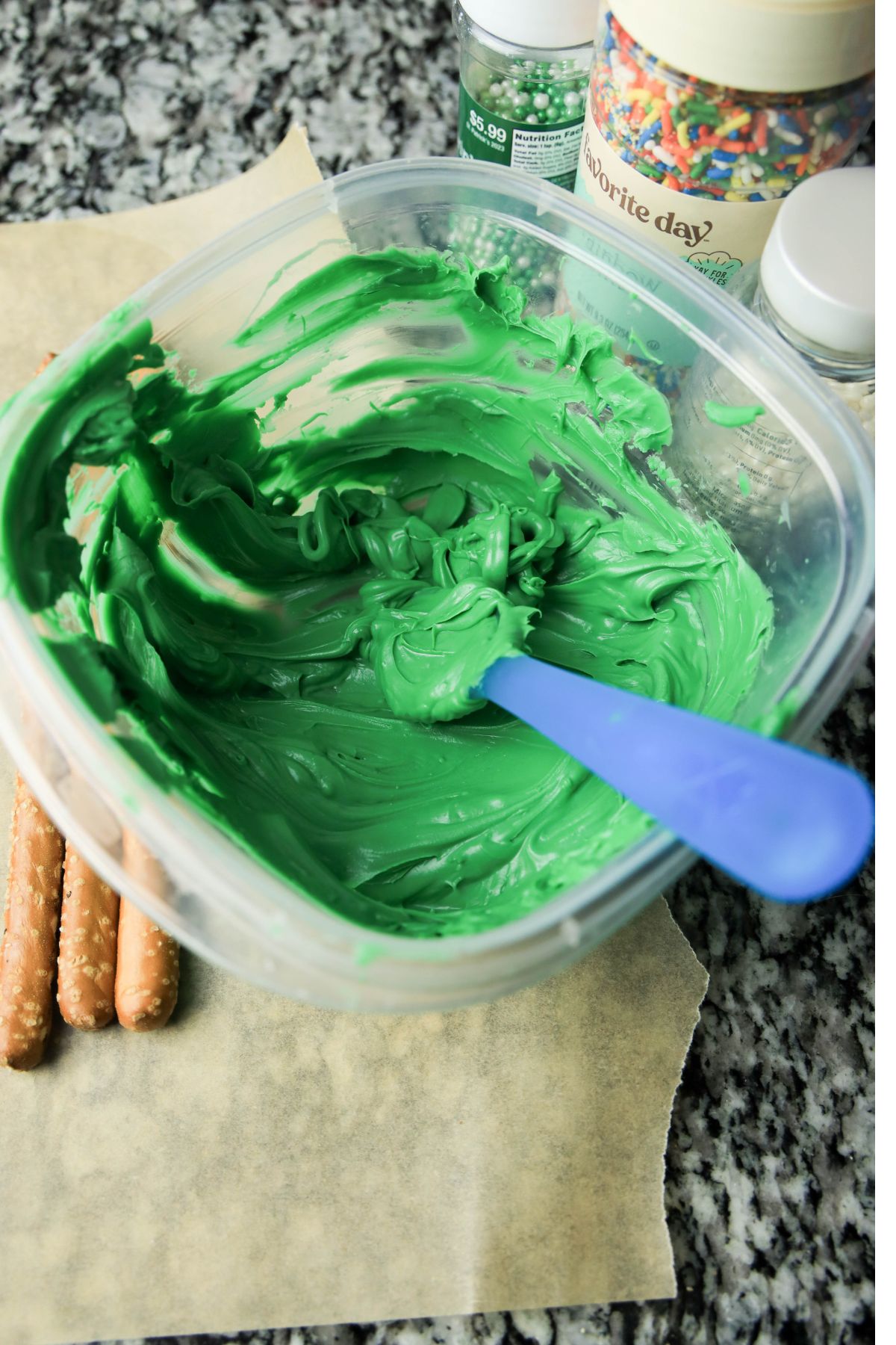 Melted green candy melts in a bowl.