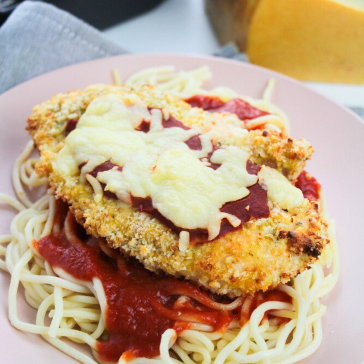 Air fryer chicken parmesan on a plate.