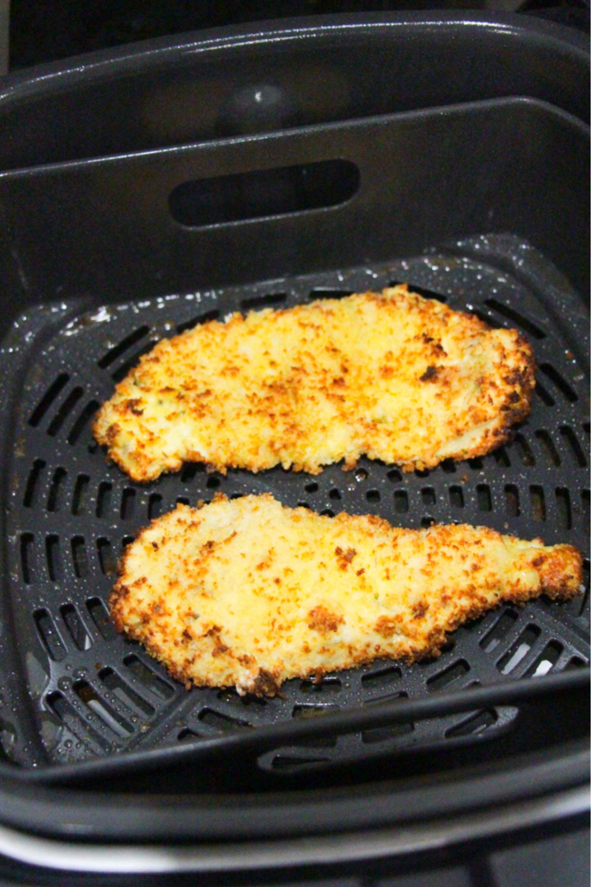 Breaded chicken in an air fryer.