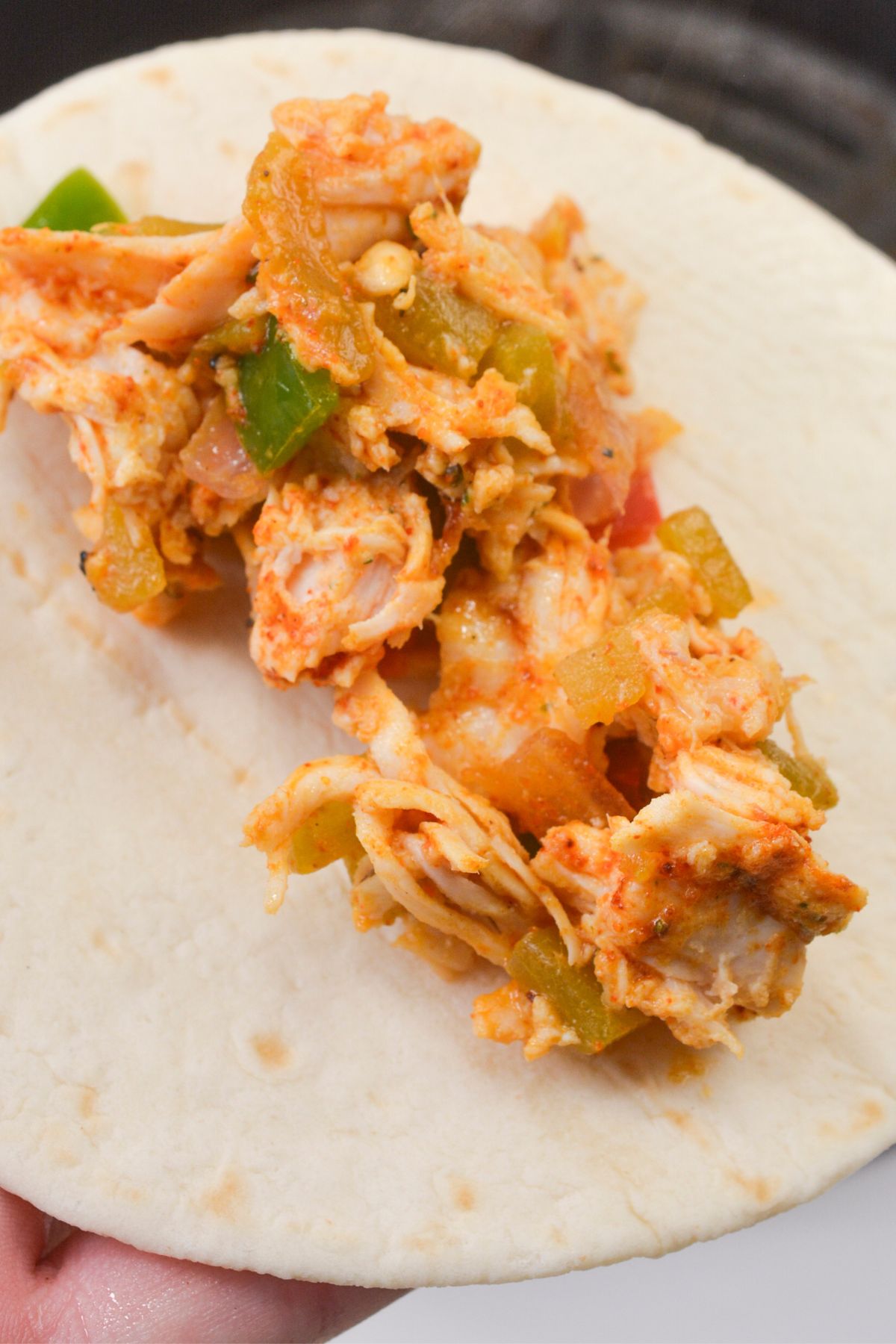 Chicken filling in a tortilla.