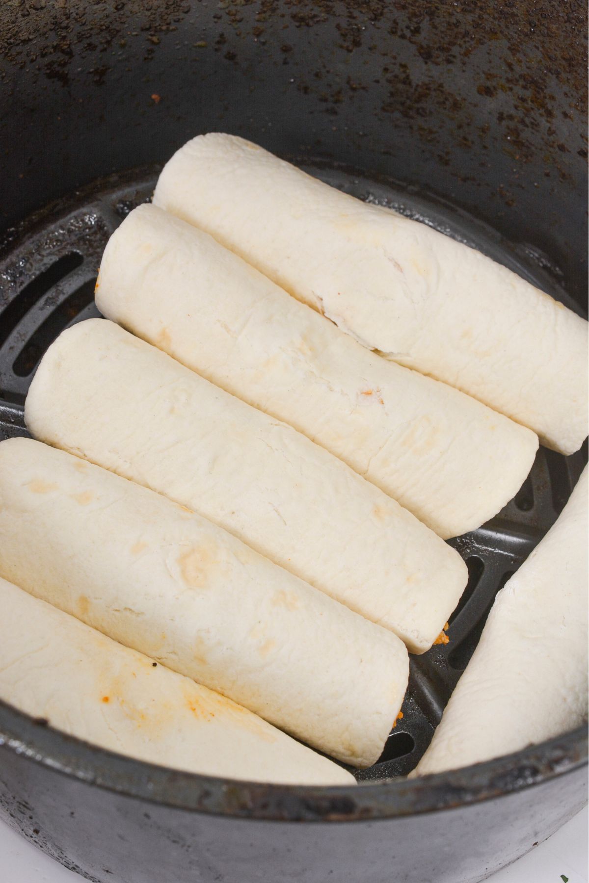 Taquitos in an air fryer.