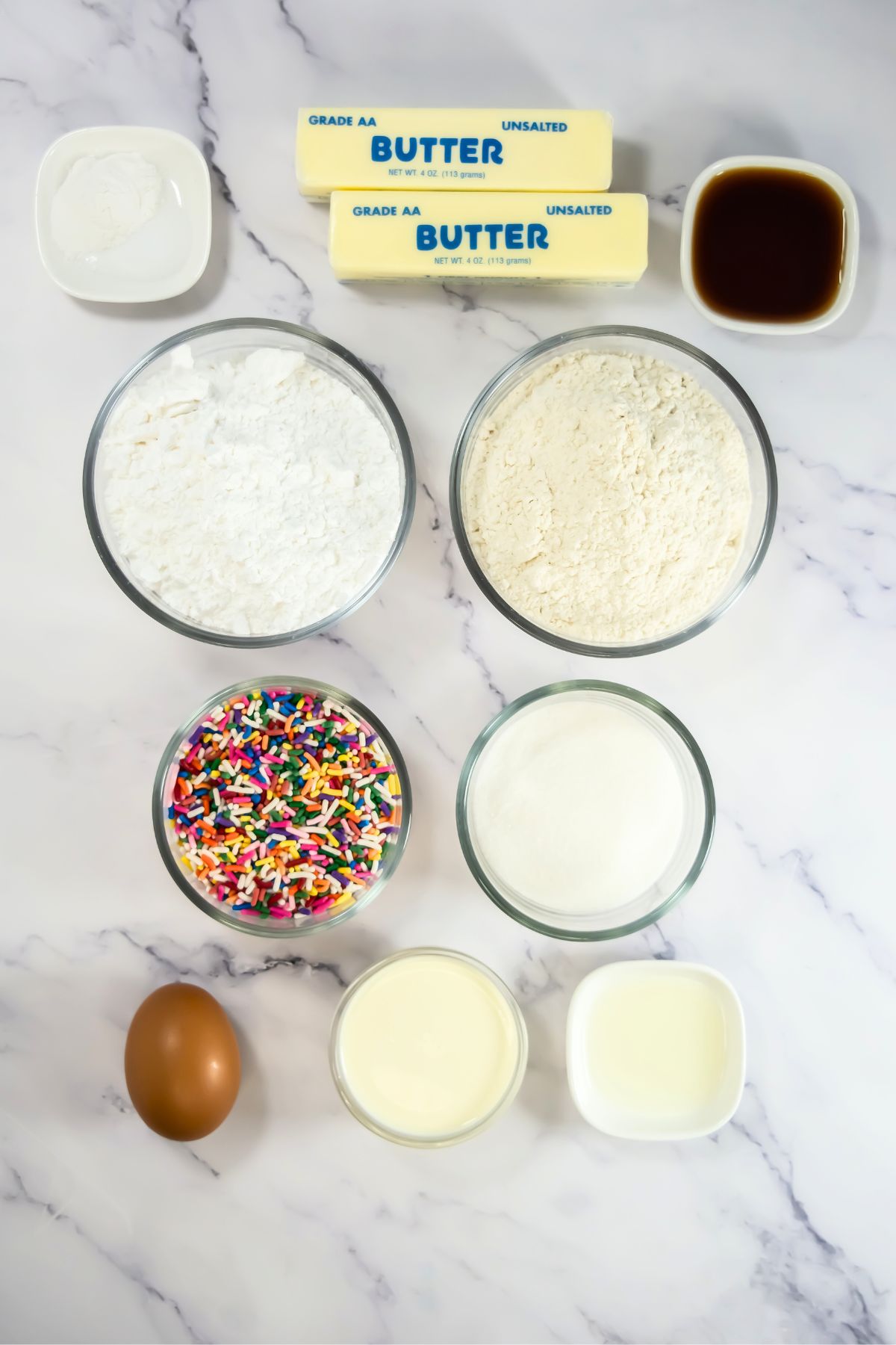 Crumbl funfetti cookie ingredients on a counter.