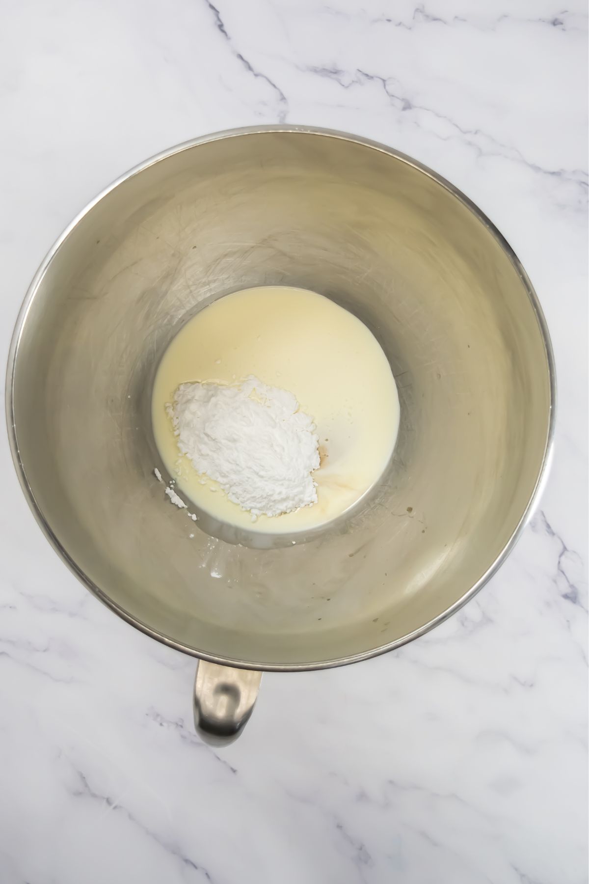 Milk and sugar in a bowl.