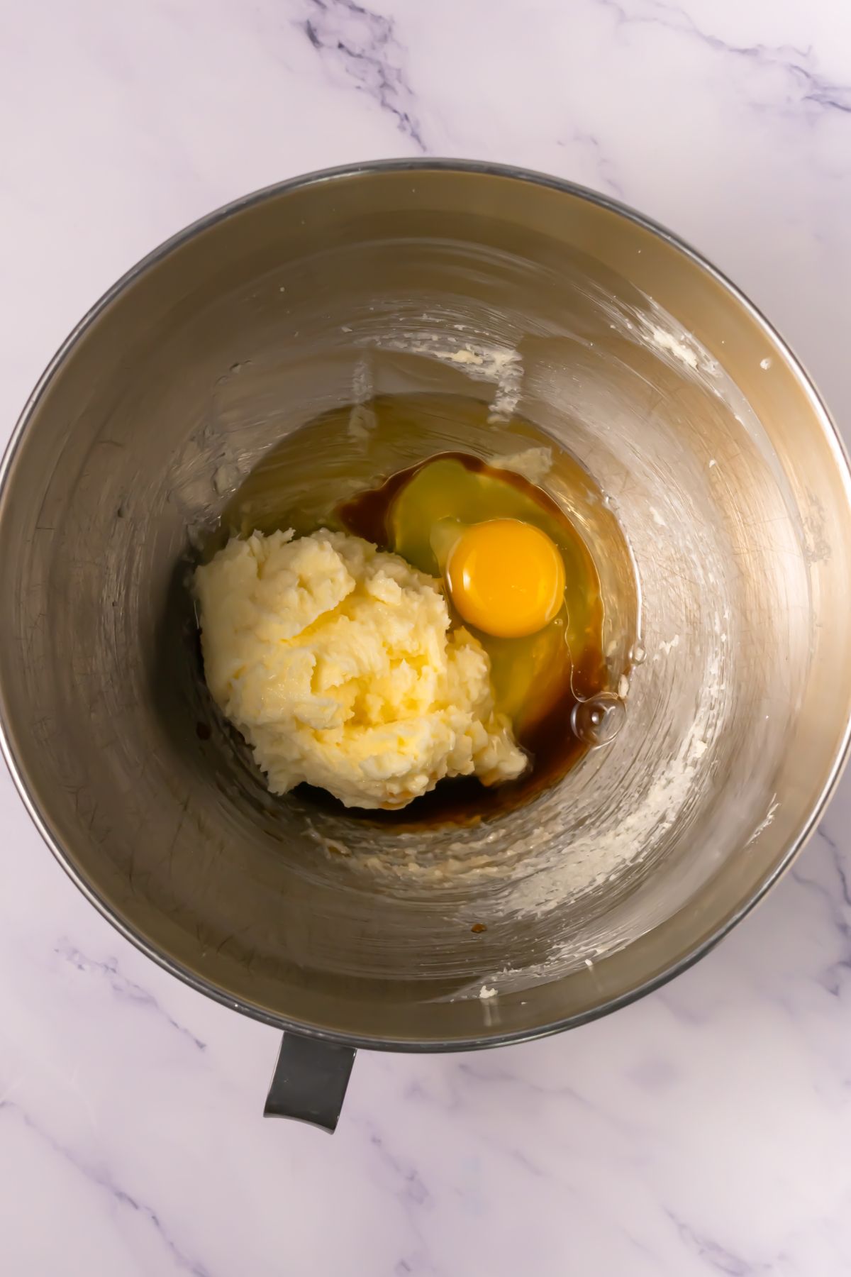 Eggs added to mixing bowl.
