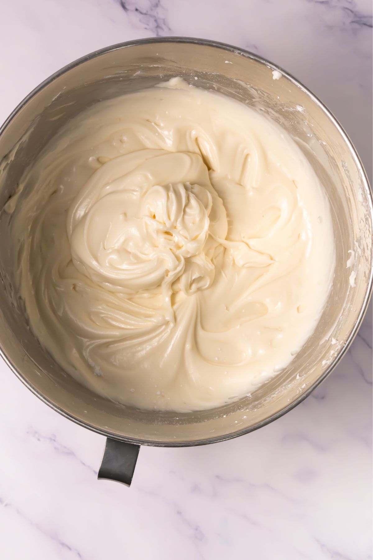 Frosting in a mixing bowl.