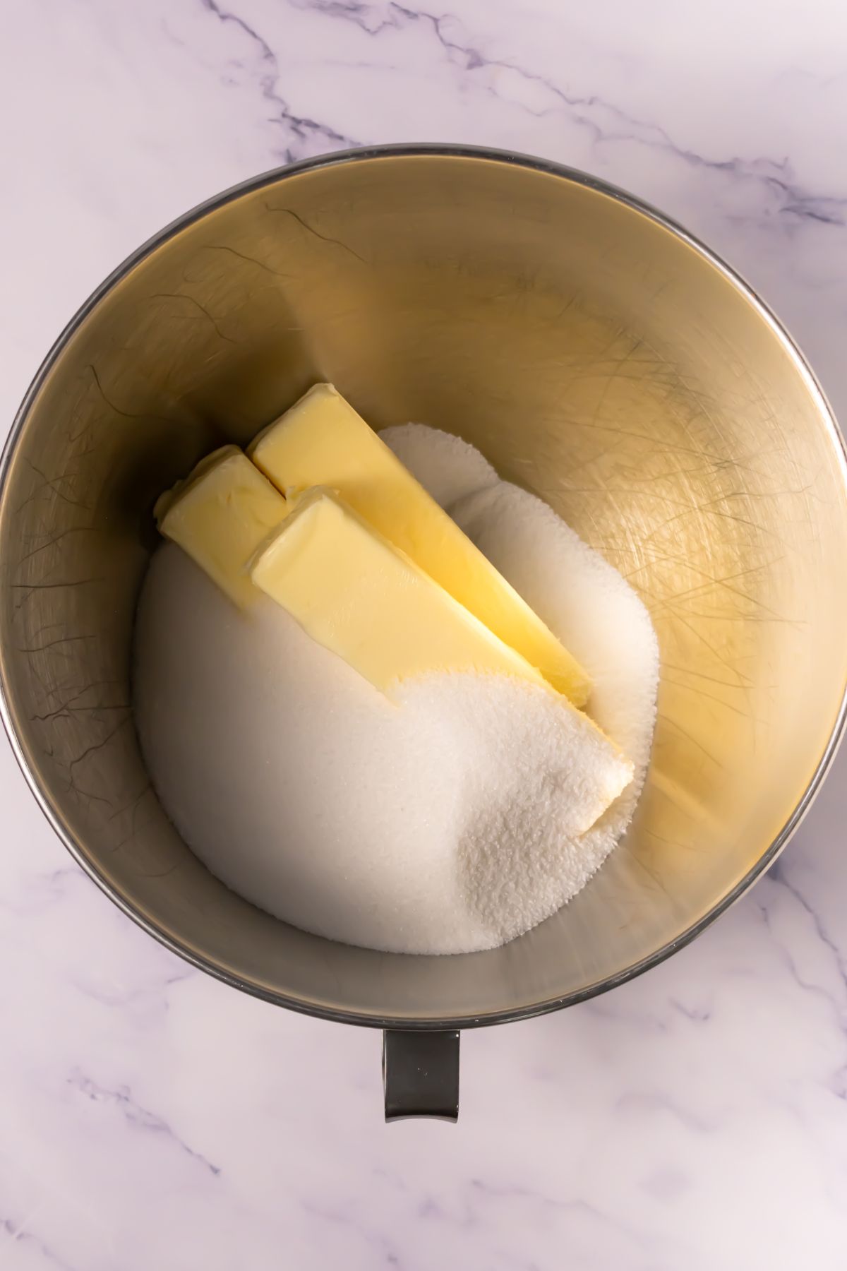 Butter and sugar in a mixing bowl.
