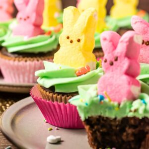 Peeps cupcakes on a plate.