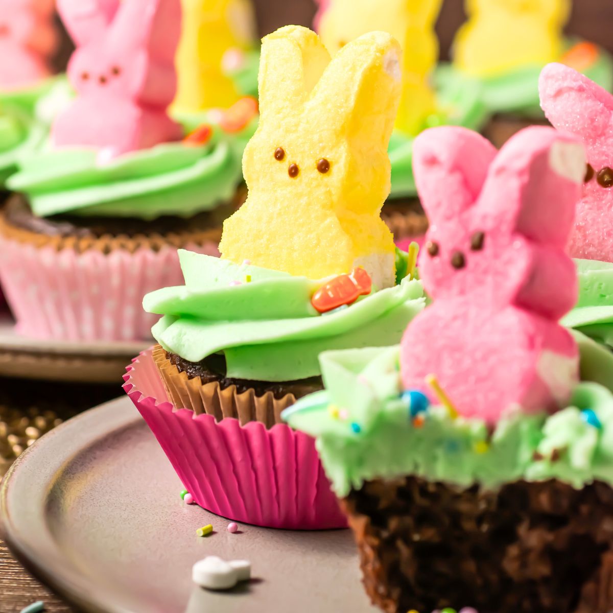 Peeps cupcakes on a plate.