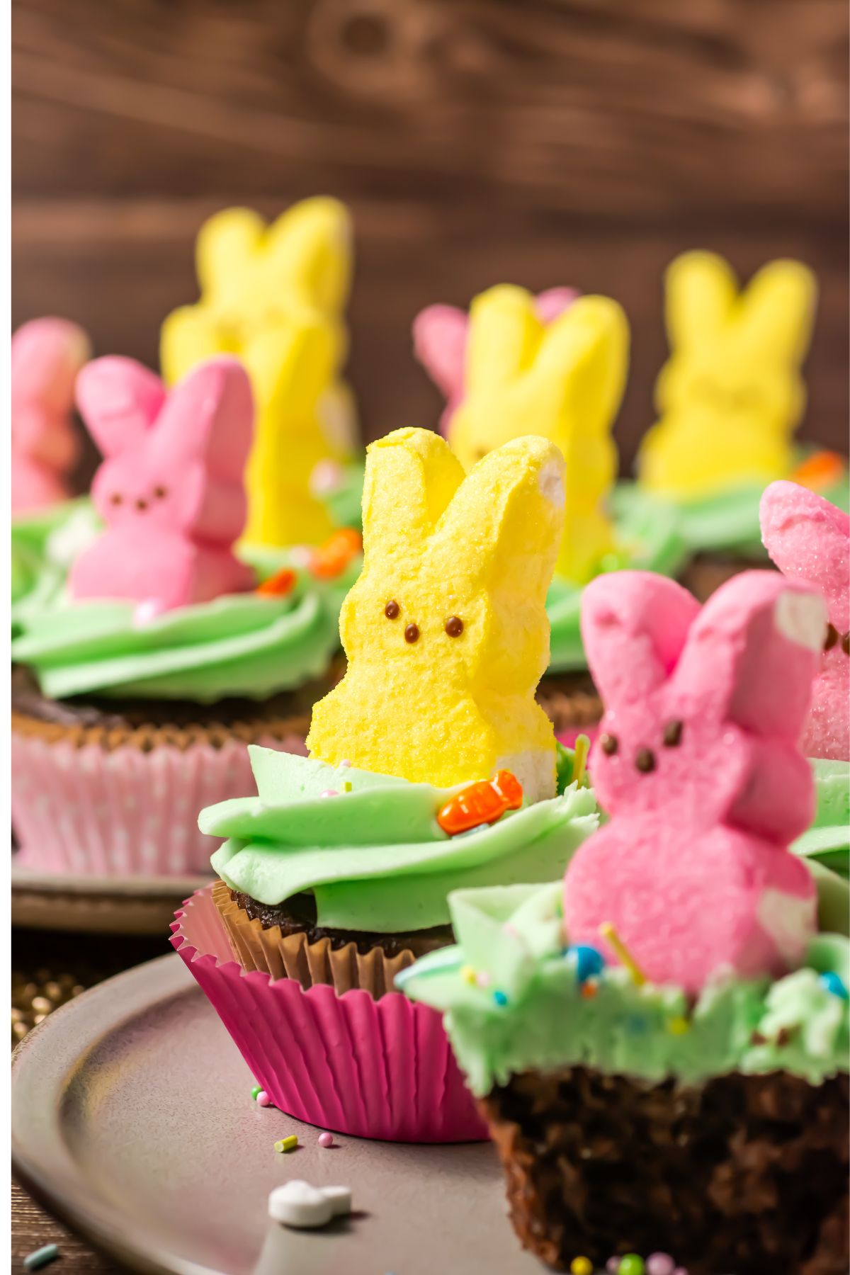 Peeps cupcakes on a plate.