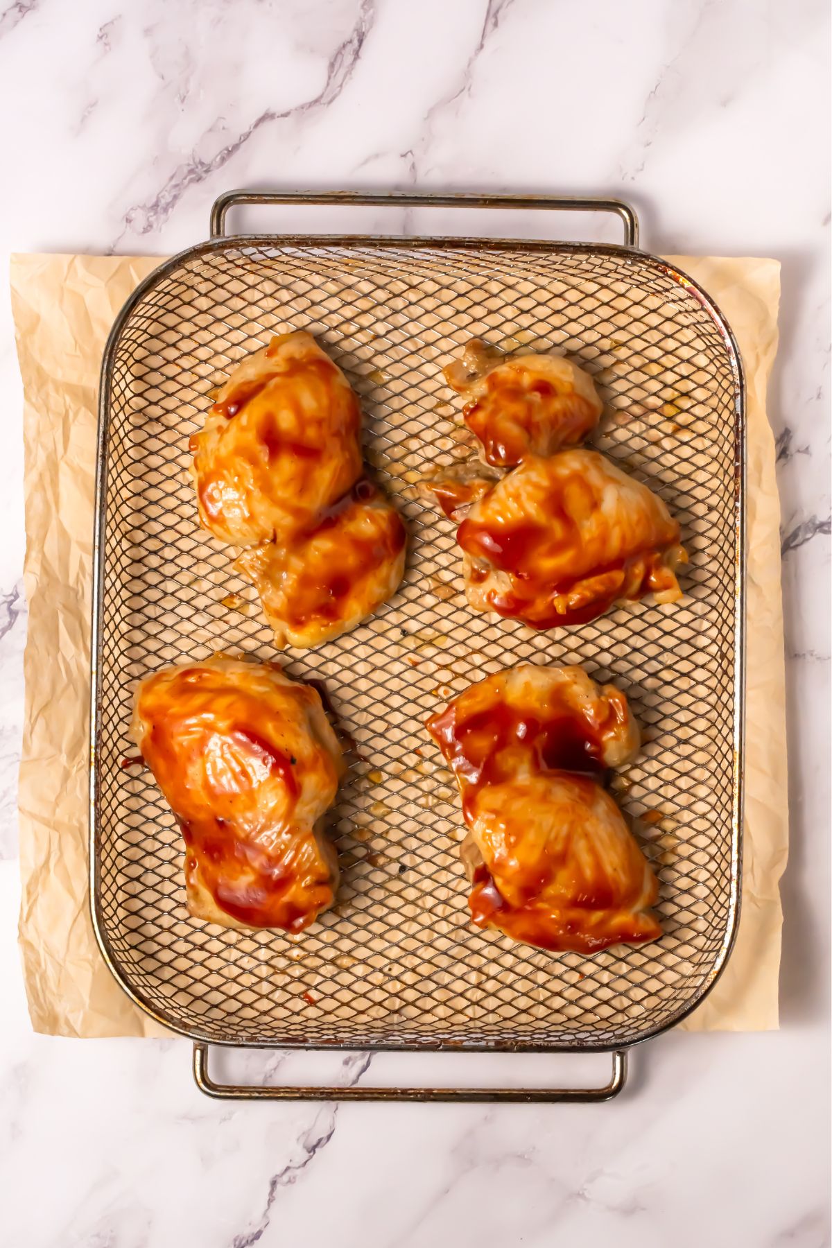 BBQ chicken thighs in an air fryer.