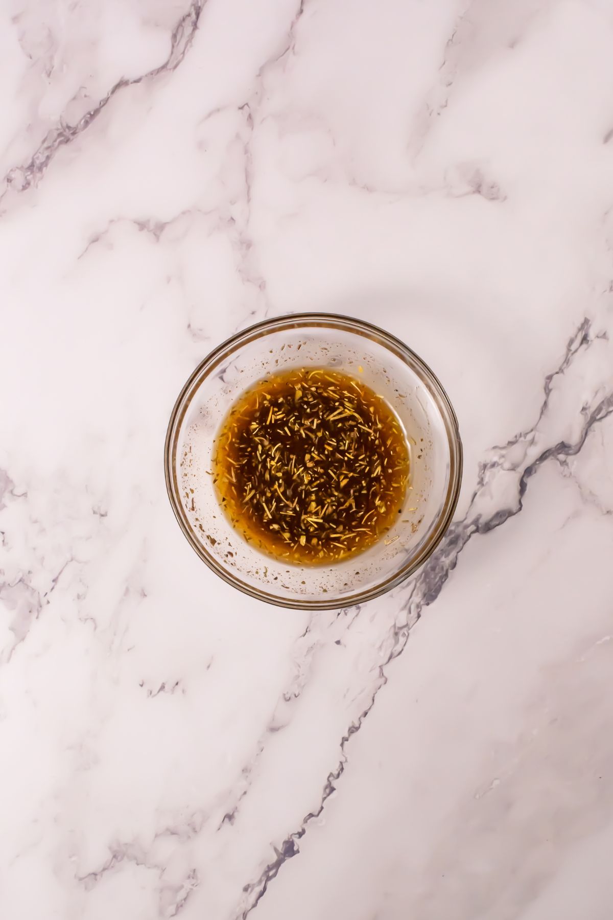 Spice mixture in a glass bowl.