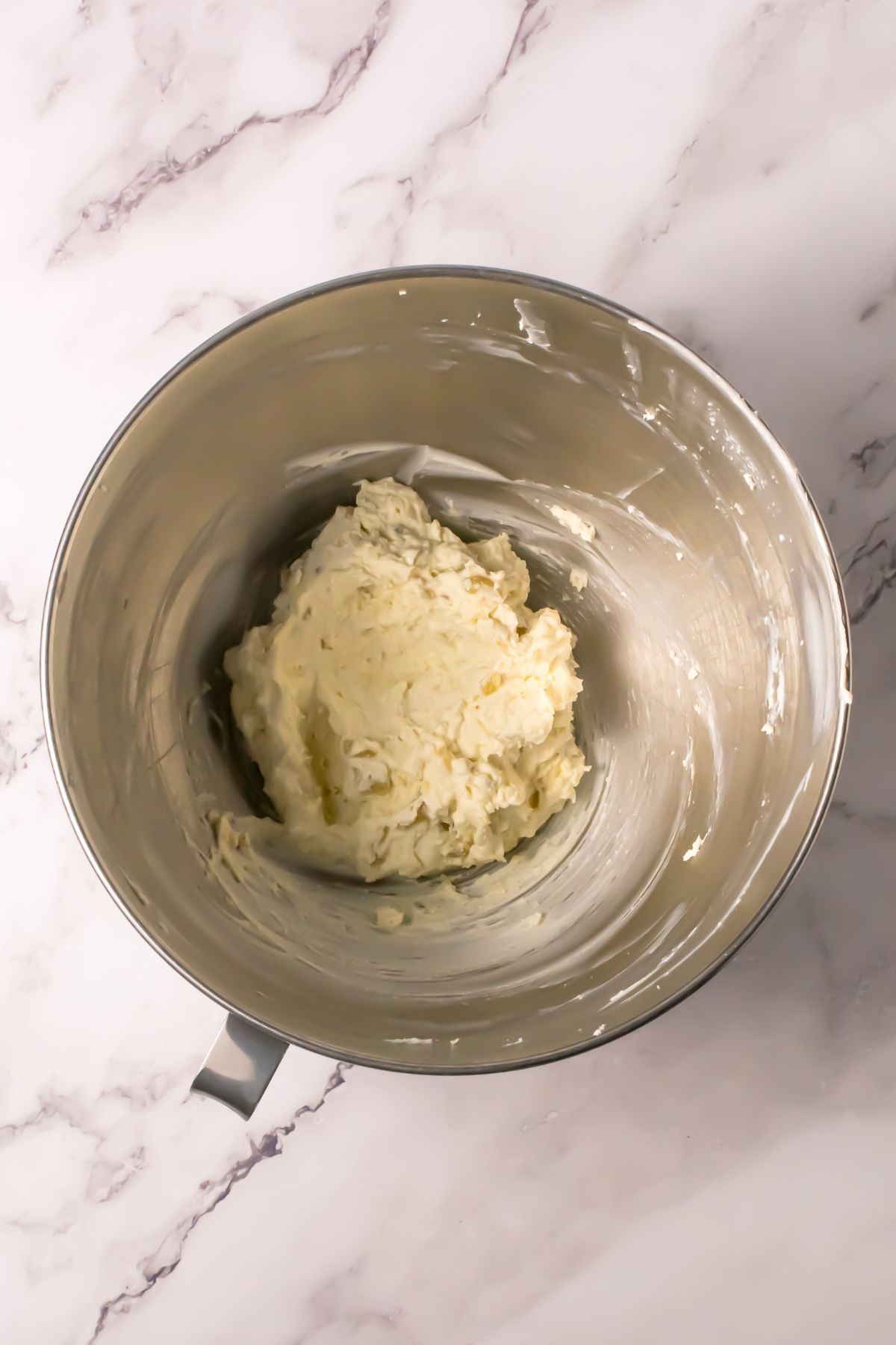Whipped filling in a mixing bowl.