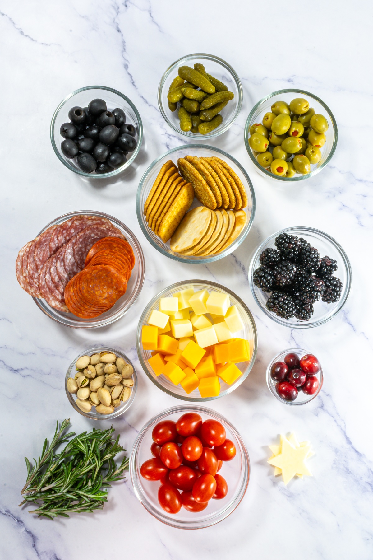 Christmas tree charcuterie board ingredients on a table.