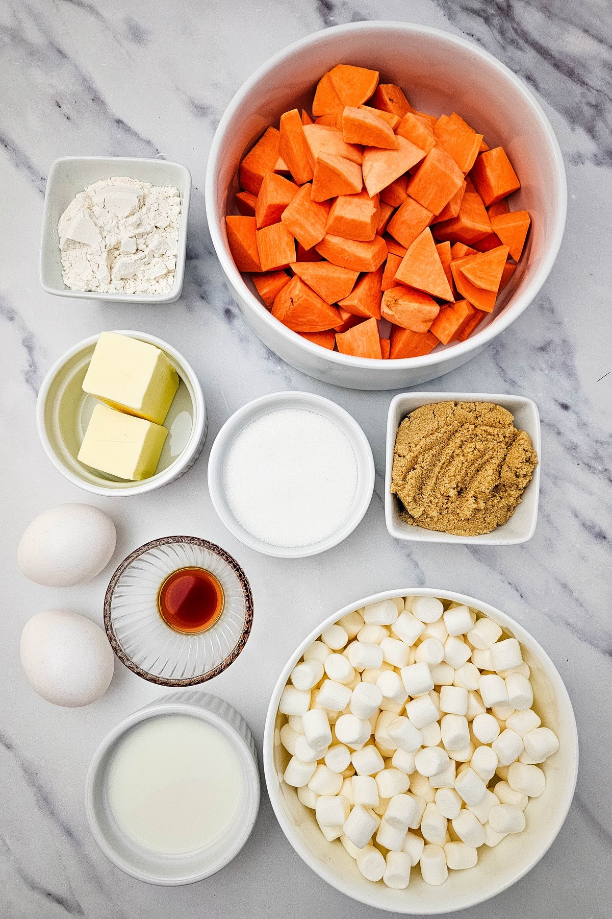 Sweet potato casserole ingredients on a counter.