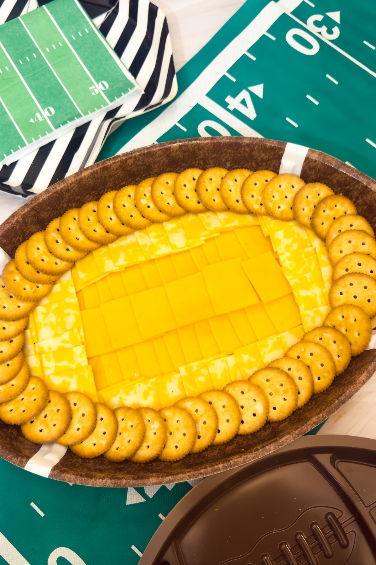Crackers added to football shaped dish.