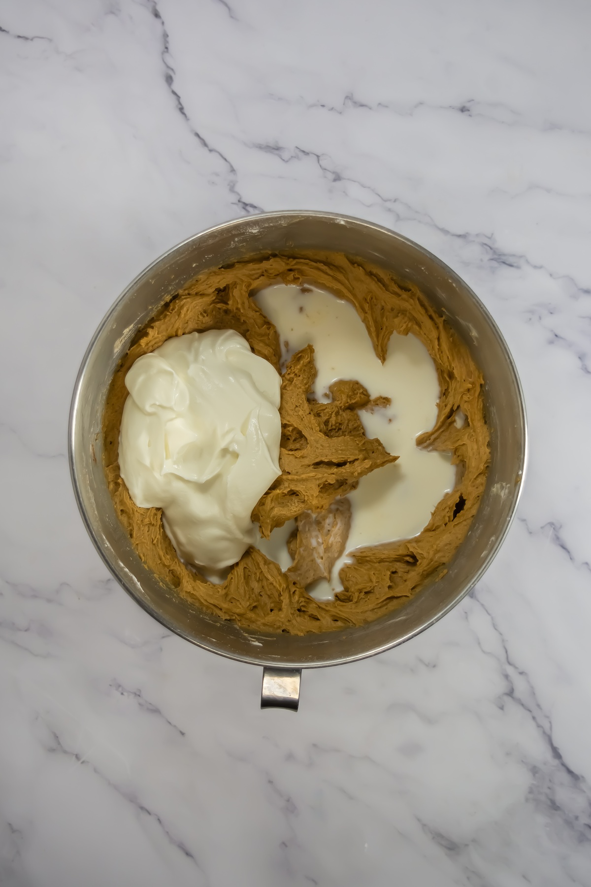 Gingerbread bundt cake ingredients mixed in a mixing bowl.