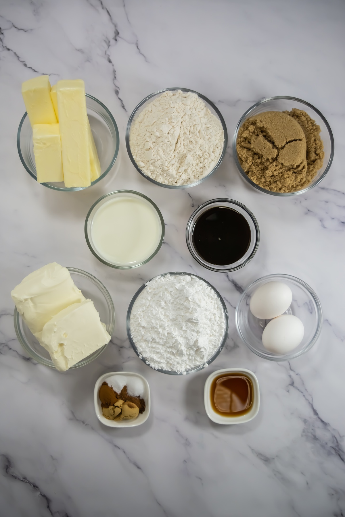 Gingerbread sheet cake ingredients on a marble table.