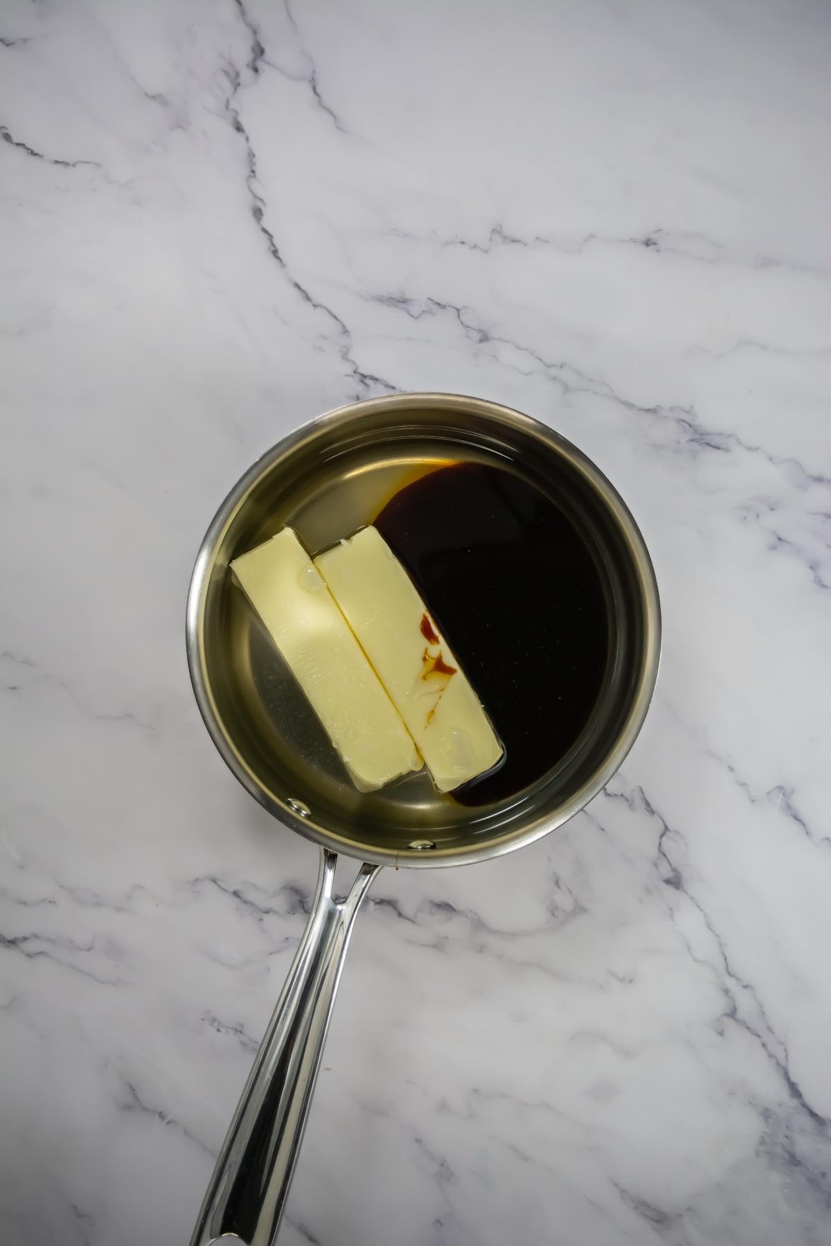 Butter and vanilla for melting in a pan.