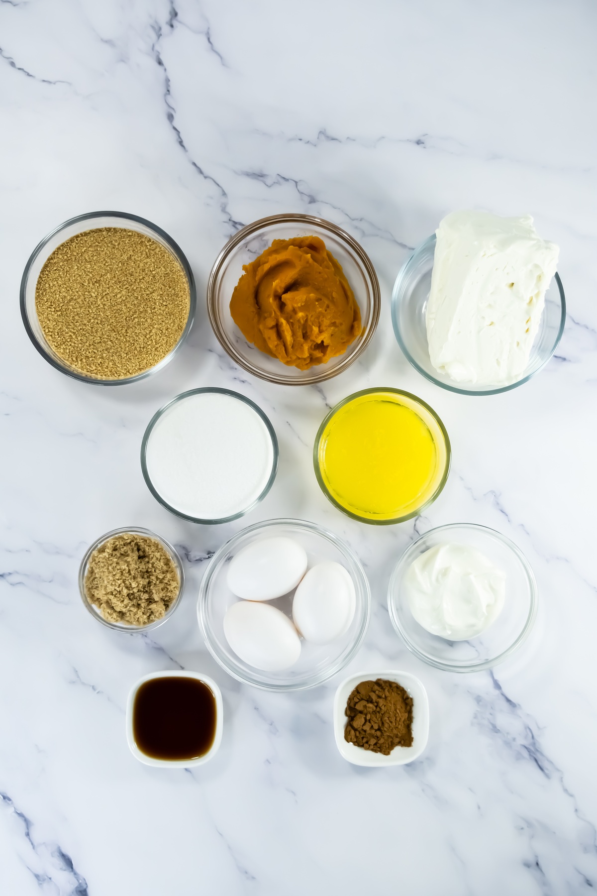 Pumpkin cheesecake bar ingredients on a table.