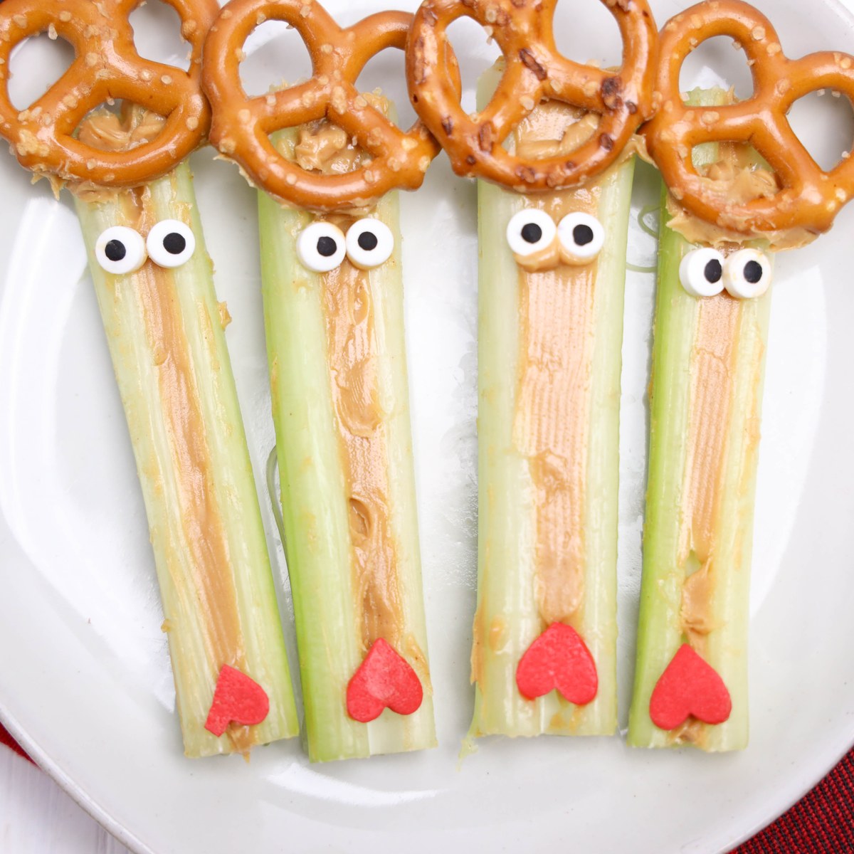 Rudolph decorated celery sticks on a plate.