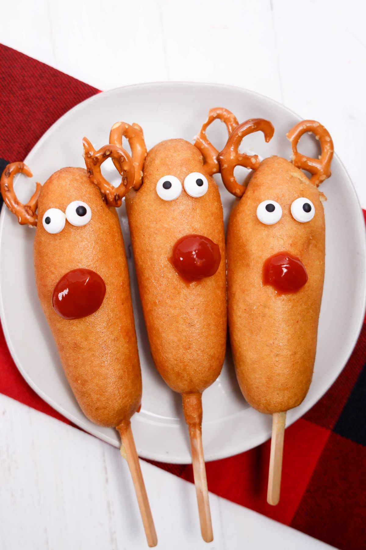 Rudolph decorated corn dogs on a plate.