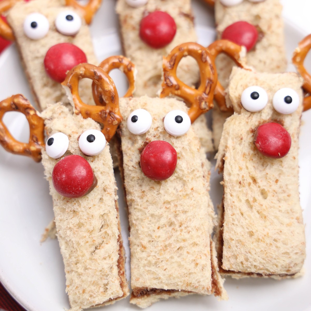 Rudolph decorated nutella sandwiches on a plate.
