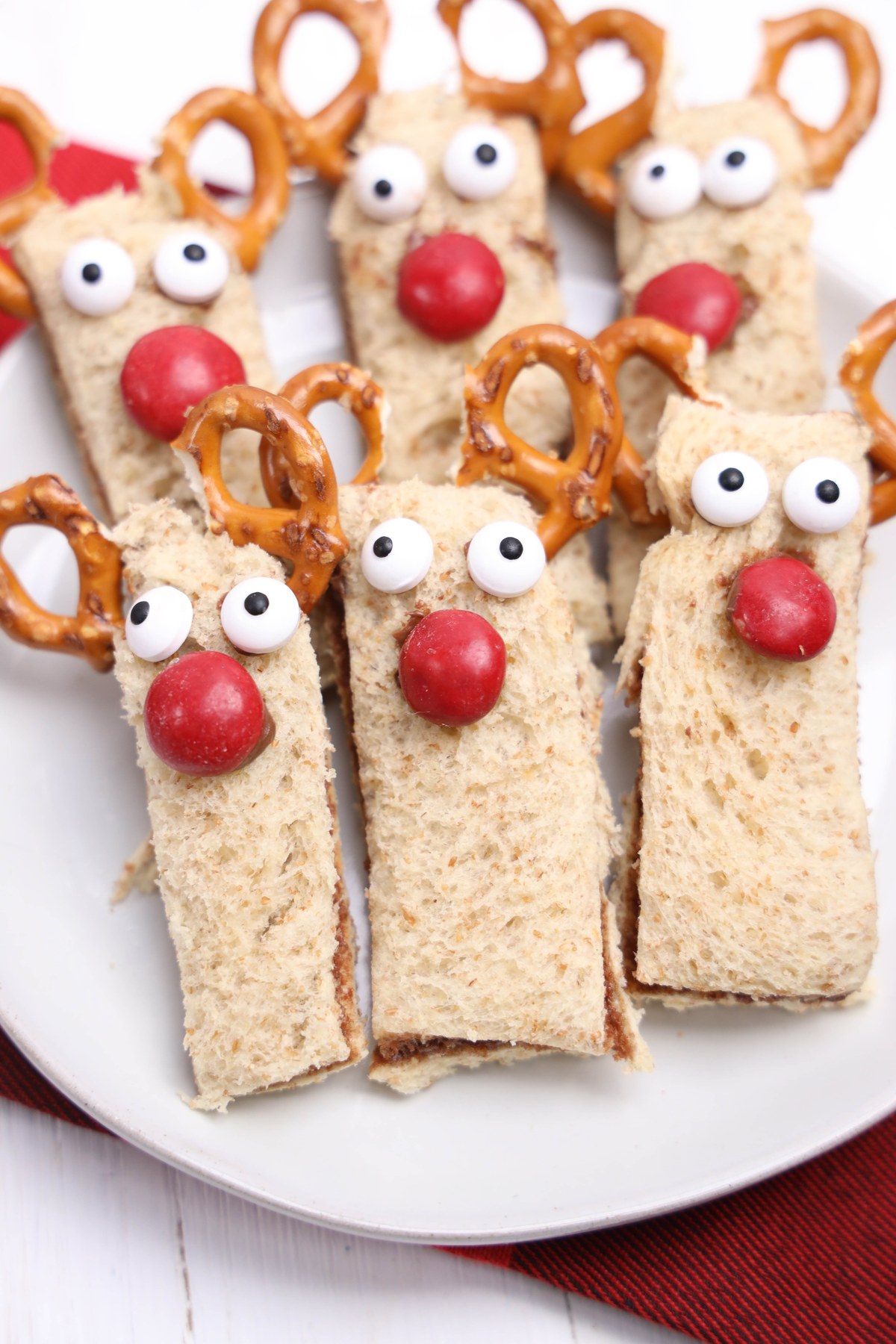 Rudolph decorated nutella sandwiches on a plate.