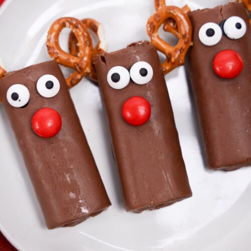 Rudolph decorated swiss rolls on a plate.