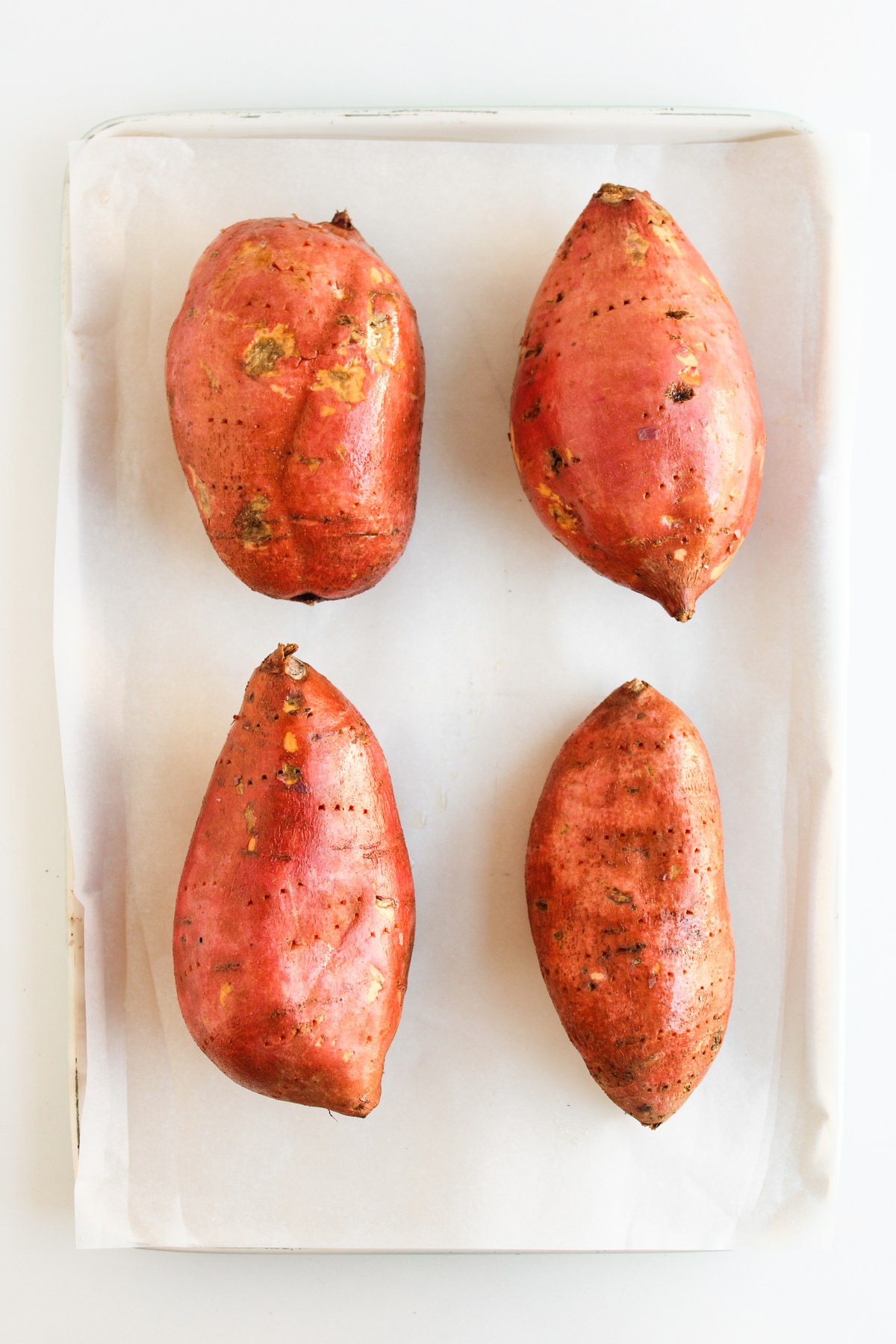 Sweet potatoes brushed with oil.