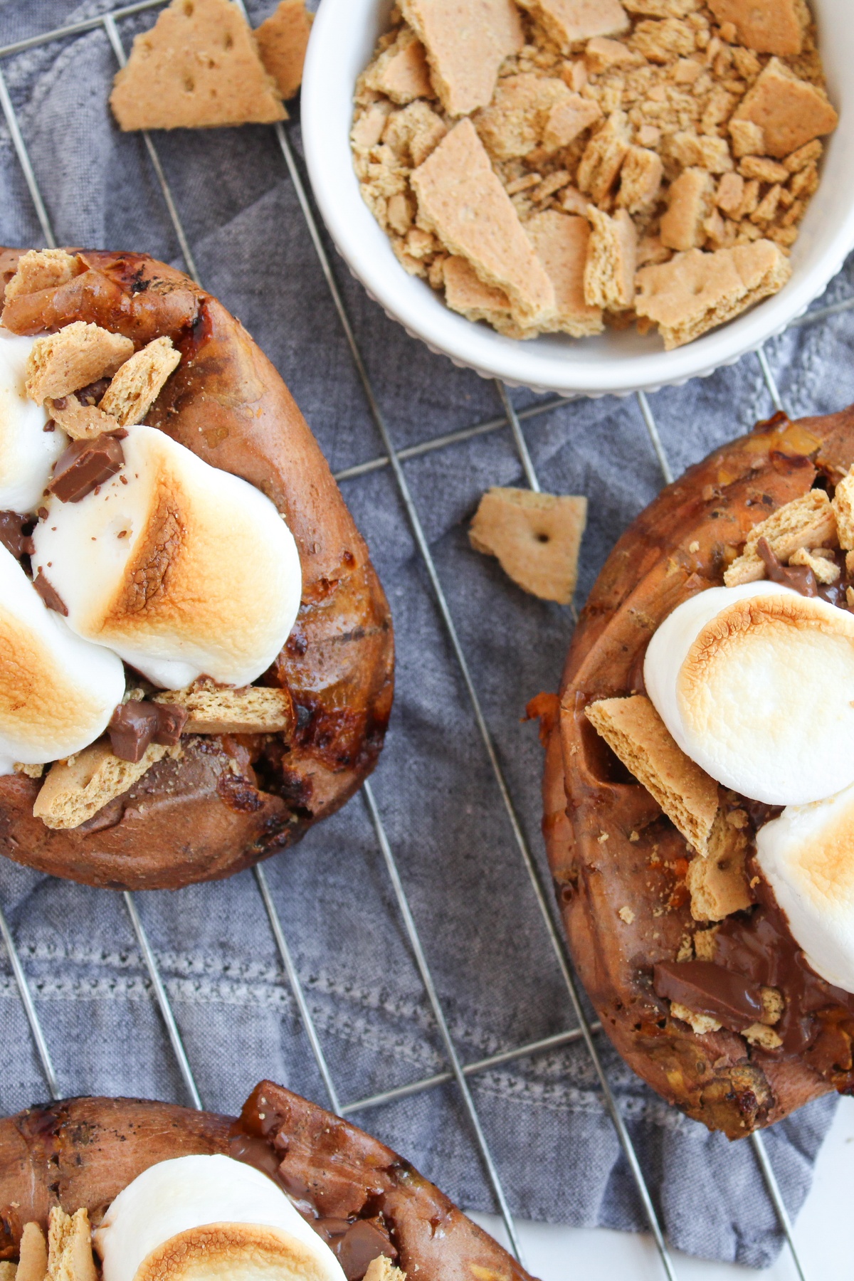 Graham crackers added to tops of sweet potatoes.