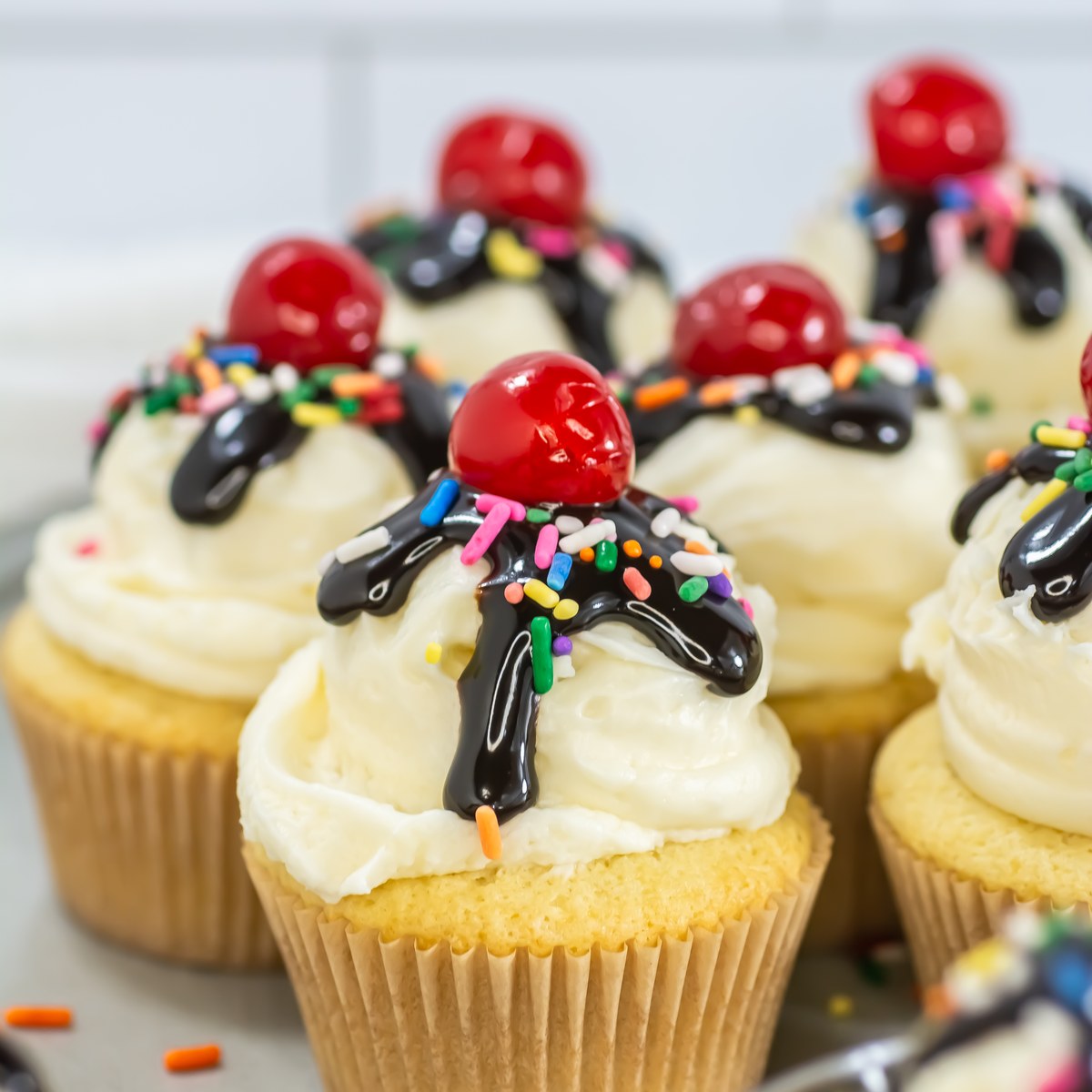 Sundae cupcakes on a plate.