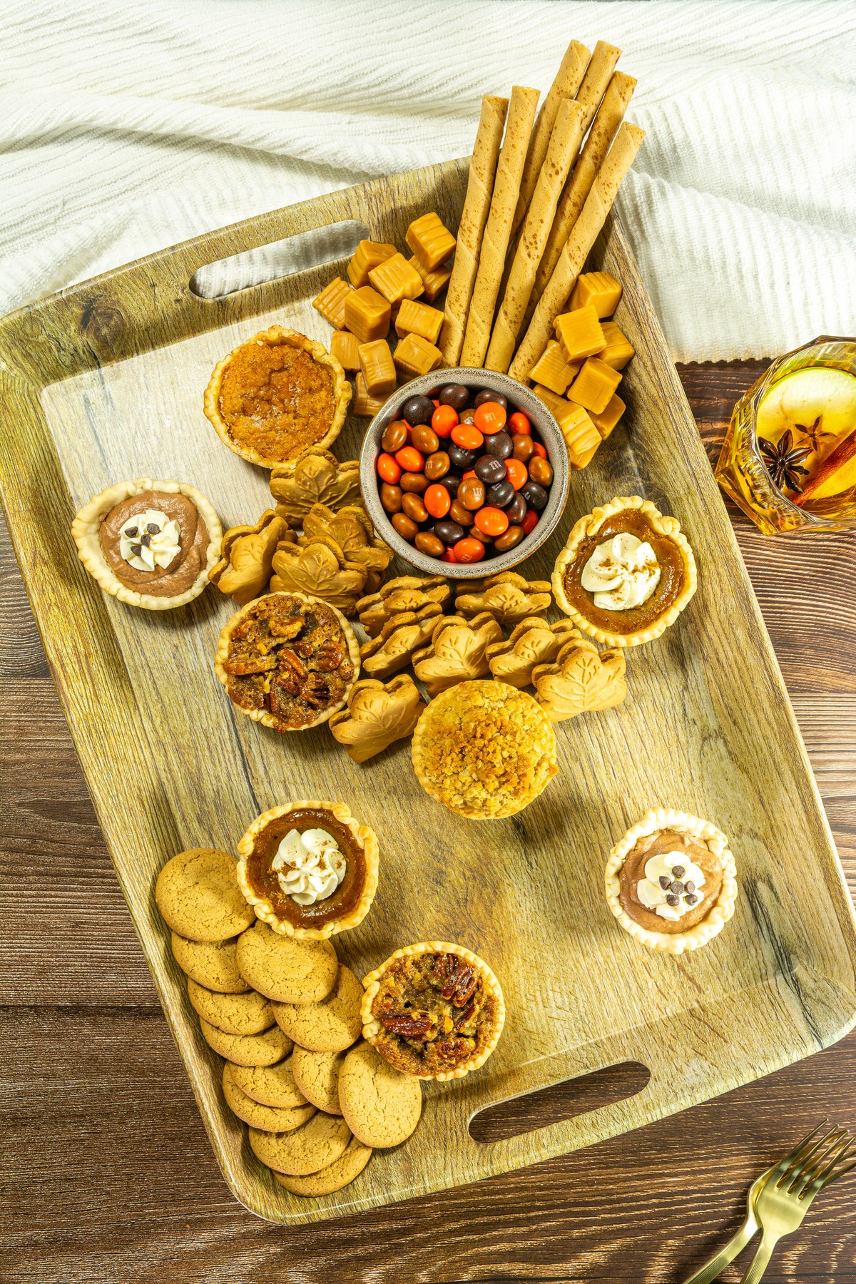 Cookies and caramels added to dessert board.