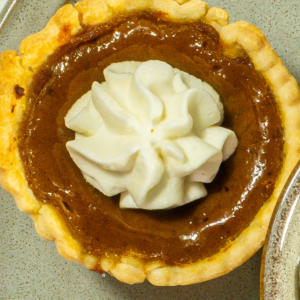 Mini chocolate silk pie on a plate.