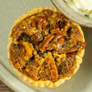 Mini pecan pie on a plate.