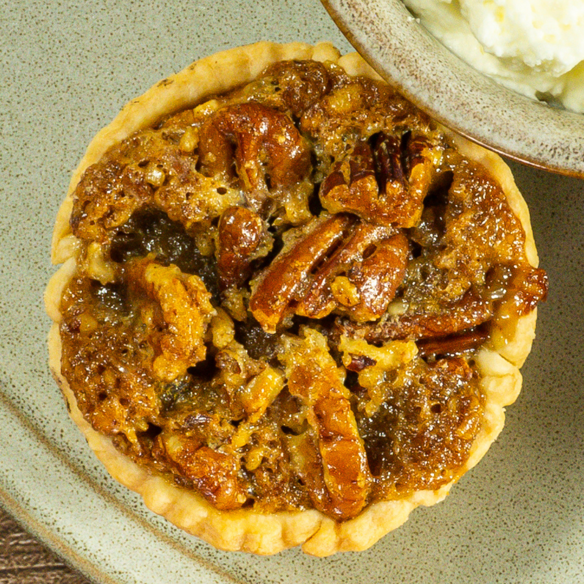 Mini pecan pie on a plate.