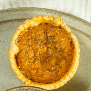 Mini sweet potato pie on a plate.