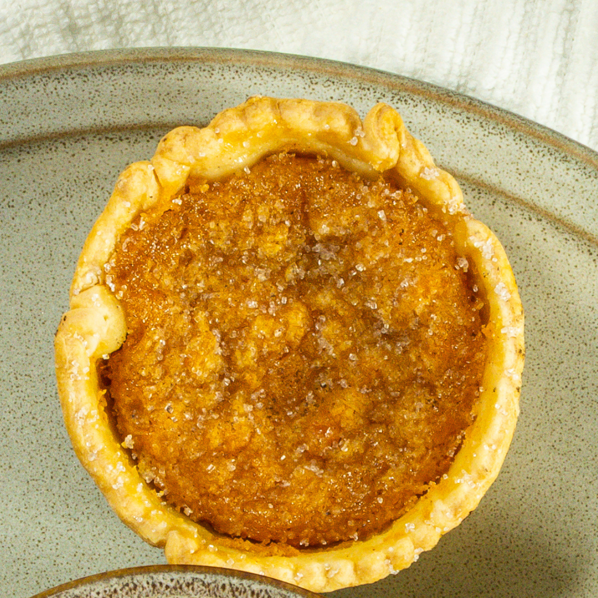 Mini sweet potato pie on a plate.